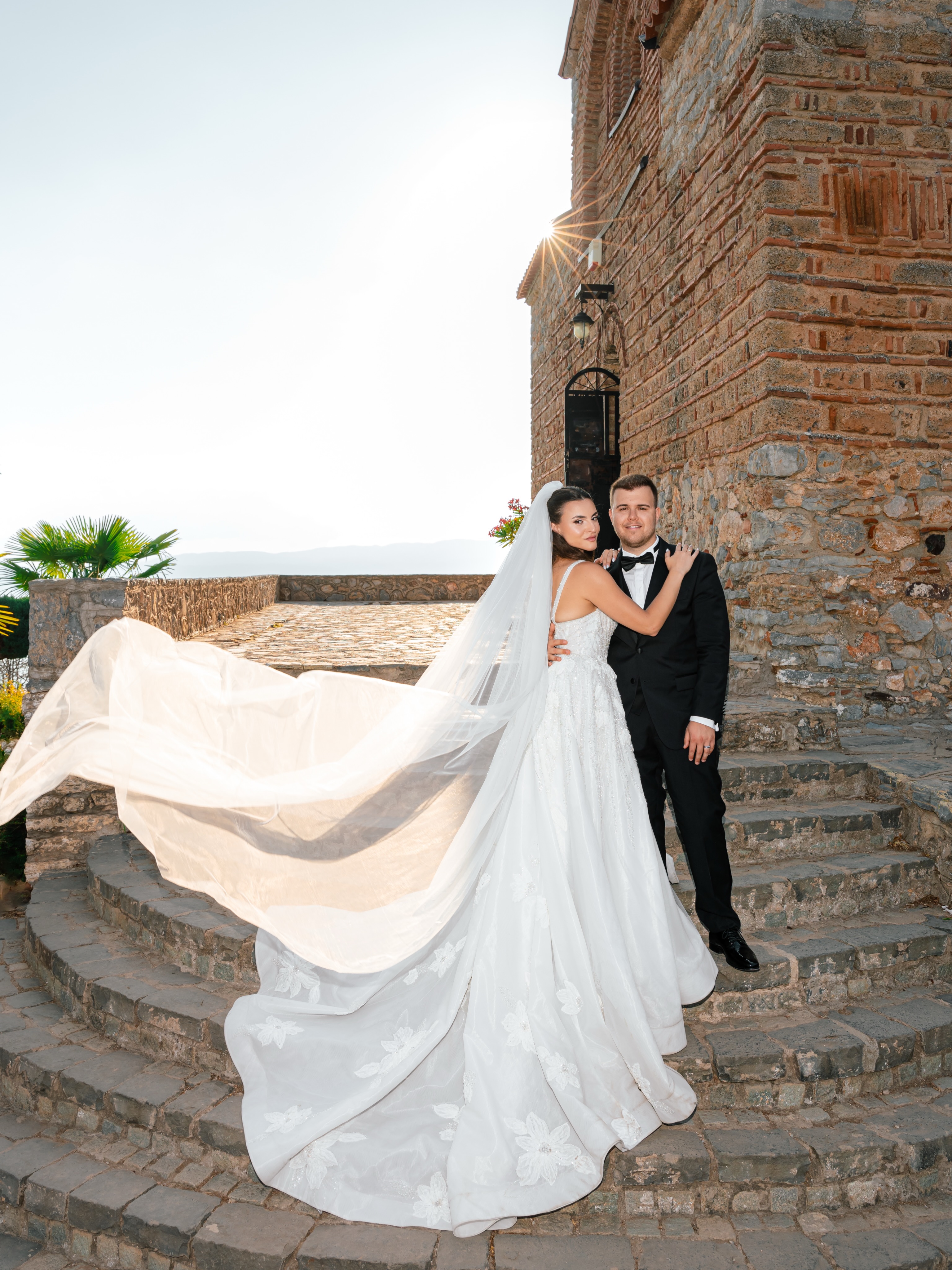 Newlyweds sharing a joyful black-and-white portrait